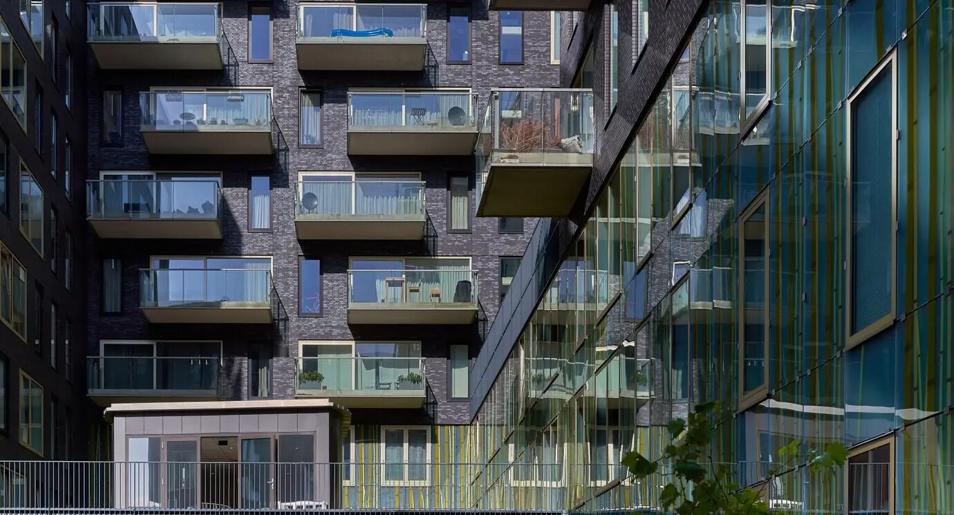 A shot of an apartment building featuring glass balconies on Gershwinlaan in Zuidas, Amsterdam.