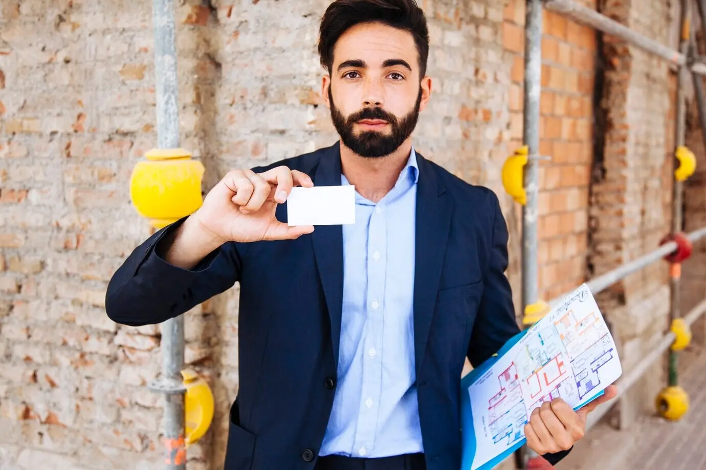 Real estate agent displaying a business card